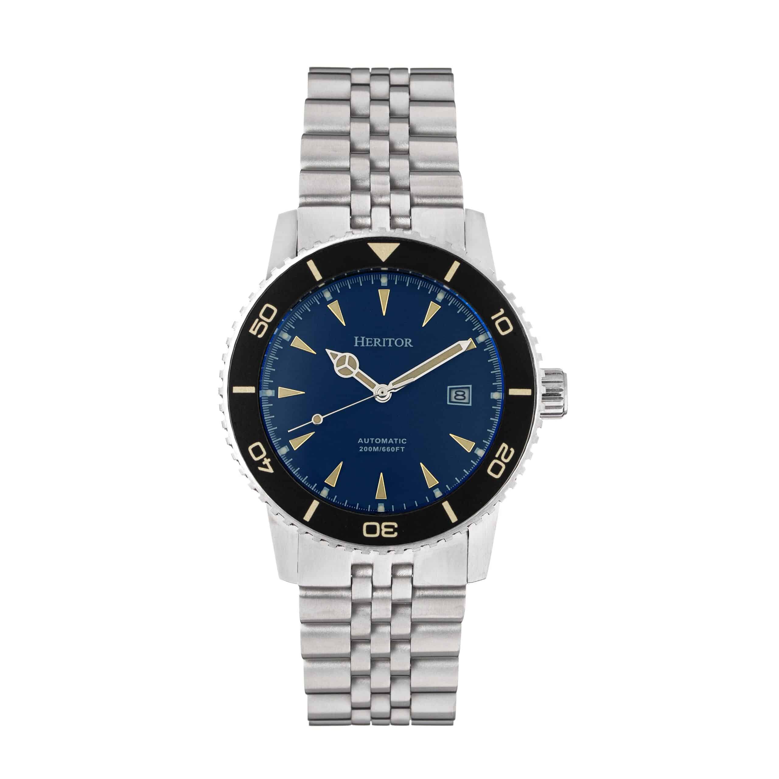 The Heritor Automatic Hurst Bracelet Watch (Navy, HERHS1902) features a silver metal link strap, blue watch face, black bezel, silver hour markers, visible Heritor branding, date display, and "Automatic 200M/660FT" text. Brand new.