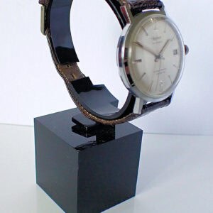 Elegant vintage Hamilton wristwatch with leather strap on display stand.