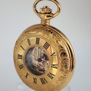 The Everite Half Hunter Watch, featuring ornate engravings, Roman numerals on the edge, and a small glass window revealing internal gears, is displayed upright against a plain background.