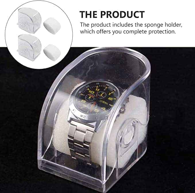A Watch Box Clear displays a silver wristwatch with a black face on a white holder inside a clear, domed case. An inset highlights the holder alone. Text notes that the Watch Box Clear provides complete protection for your timepiece.