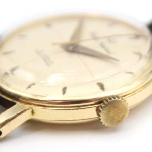 Vintage gold men's watch with black leather strap, classic design, luxury timepiece, The Watchaholic.