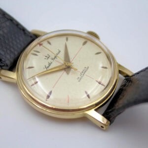 Vintage gold wristwatch with black leather strap, classic design, and Shockproof feature.