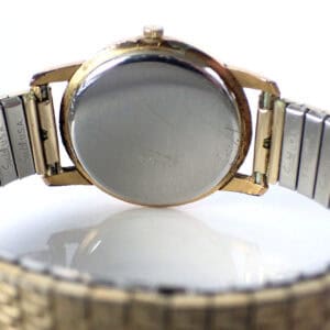 Rolex vintage watch photo, gold and stainless steel band, back view showing craftsmanship.