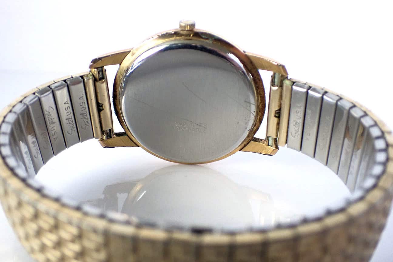 Rolex vintage watch photo, gold and stainless steel band, back view showing craftsmanship.