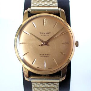 Vintage gold men's watch with minimalist dial and leather strap, Swiss-made timepiece.