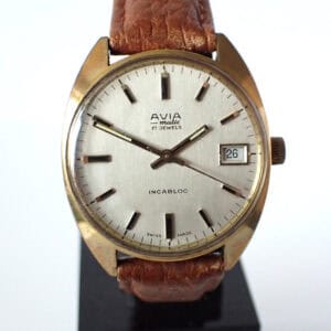 Luxury vintage AVIA wristwatch with date display and leather strap.