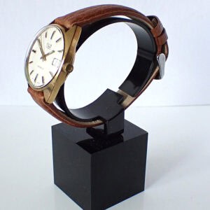 Stainless steel and leather men's wristwatch on display.