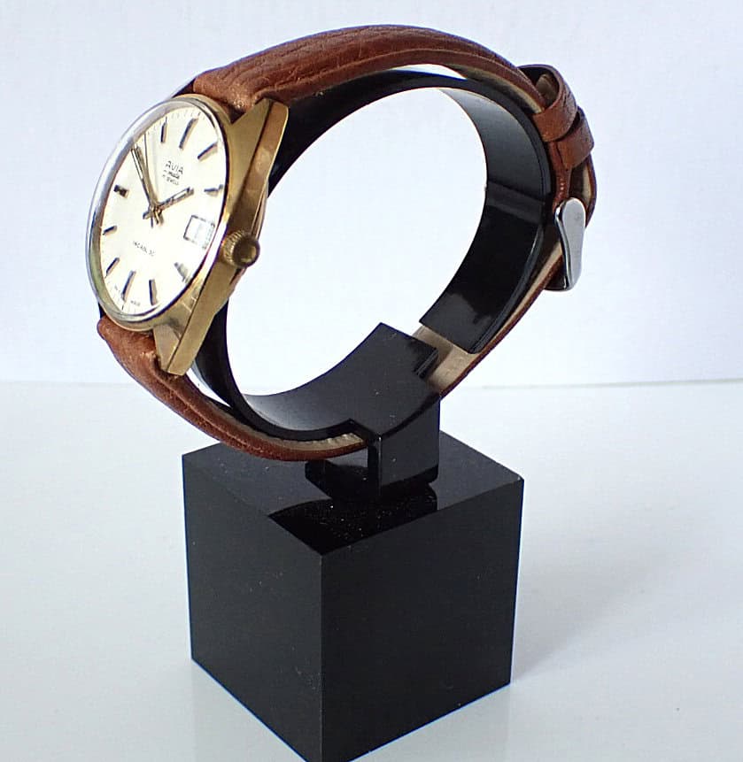Stainless steel and leather men's wristwatch on display.