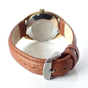 Vintage leather strap wristwatch with silver case, classic design, ideal for watch enthusiasts and collectors.