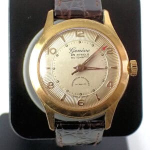 Vintage gold Genève automatic wristwatch with leather strap, rare 25 jewels movement.