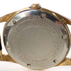 Stainless steel waterproof vintage watch back with gold-tone case.