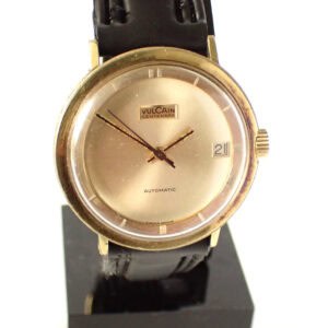 Vintage Vulcain Centenary automatic wristwatch with gold case and black leather strap.