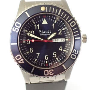 Stauer Swiss Dive watch with black dial and rotating bezel, stainless steel bracelet, water-resistant design.