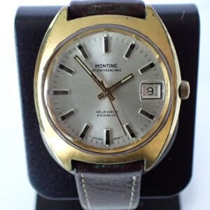 18ct gold vintage Montine Swiss men's wristwatch with date display and leather strap.