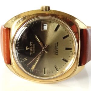 The Tissot Seastar Automatic 44661-4X Calibre 2841 features a gold-toned case, brown leather strap, and date display at 3 o’clock on its round metallic dial. Pay interest-free in three with Klarna.