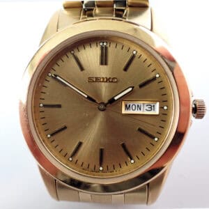A Seiko Champagne Dial Watch SGGA48P1 (£170) shows 8:20, with the day "MON" and date "31" on its face, set against a plain white background. Pay interest-free in three with Klarna.