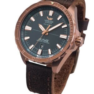 The Vostok-Europe Almaz Bronze Automatic Watch NH35/320O507 features a black dial, luminous hands and markers, date at 6 o'clock, and a brown textured leather strap. Brand new—pay with Klarna.