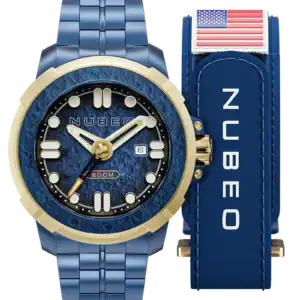 The NUBEO Commander Blue NASA NB-6072-33 features a textured blue dial, bold markers, date display, and a matching blue metal strap. It’s pictured beside a blue Nubeo box topped with an American flag patch.