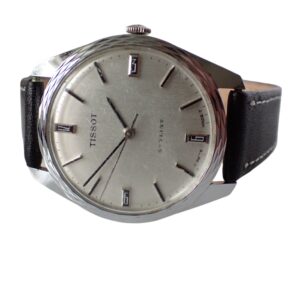 The Tissot Stylist Mechanical Watch features a silver round face, black hour markers, and a black leather strap, shown on a white background.