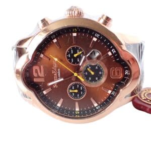 A close-up of the sold-out Swan and Edgar Elliptical Automatic Chronograph shows a brown dial with three sub-dials, gold accents, and a gold case. The new watch has protective plastic, a red tag, and displays the time at about 10:08.