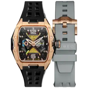 The NUBEO DAVINCI AUTOMATIC LIMITED EDITION Solar Dust NB-6078-07 showcases a rose gold rectangular case, black and gold skeleton dial, bold modern design with visible screws, black strap fitted, and an extra grey strap included.