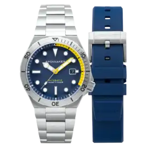 The Spinnaker Boettger Automatic SP-5083-DD features a silver case, blue and yellow accented dial, stainless steel bracelet, extra blue rubber strap, and date display at 3 o’clock.