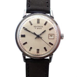 A vintage SEKONDA 2414 POLJOT 17 Jewels c.1970 wristwatch with a white dial, black hour markers, date window at 3 o'clock, and black leather strap. The hands show 10:10 and the face reads SEKONDA 17 jewels.