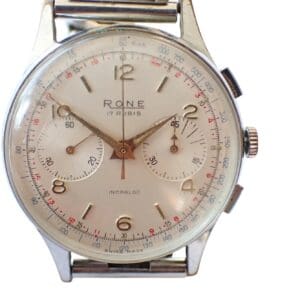 A vintage Rone Chronograph wristwatch with a silver case, white dial, gold hands, two subdials, and black/red numerals. The time displayed is 2:18:32.