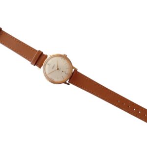 Leather strap watch with gold case and minimalist dial, stylish men's accessory.