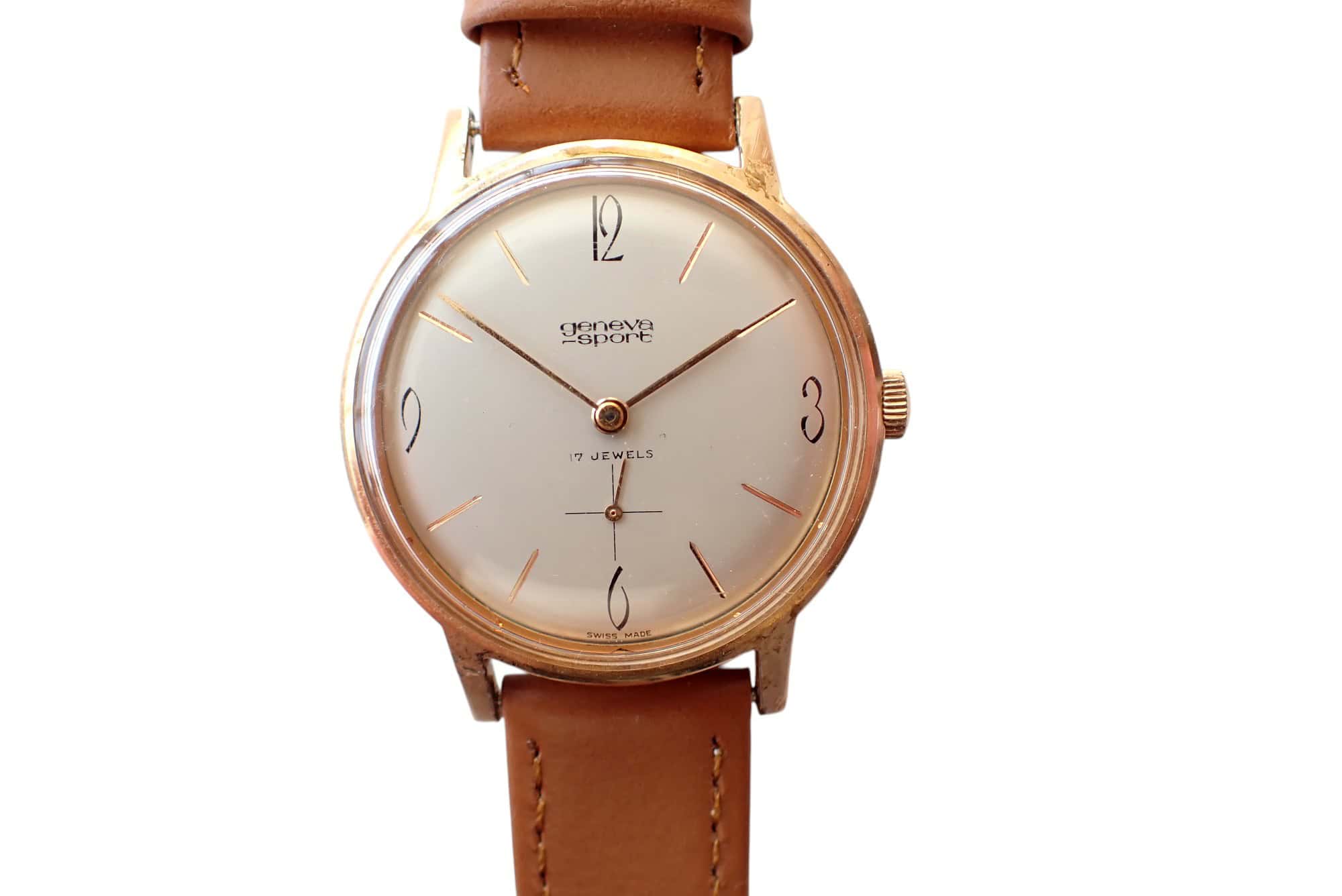 Antique Geneva Sport wristwatch with leather strap and minimalist dial.