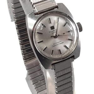 Seastar Seven vintage Tissot automatic watch with stainless steel bracelet and silver dial.