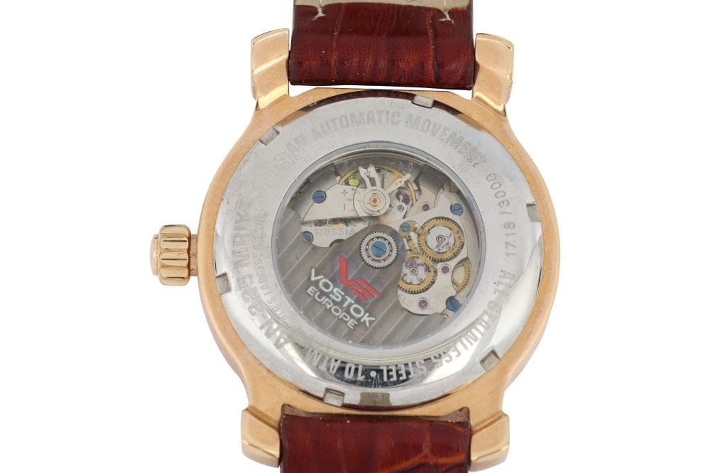 Luxury Vostok Europe automatic watch with visible movement and leather strap.