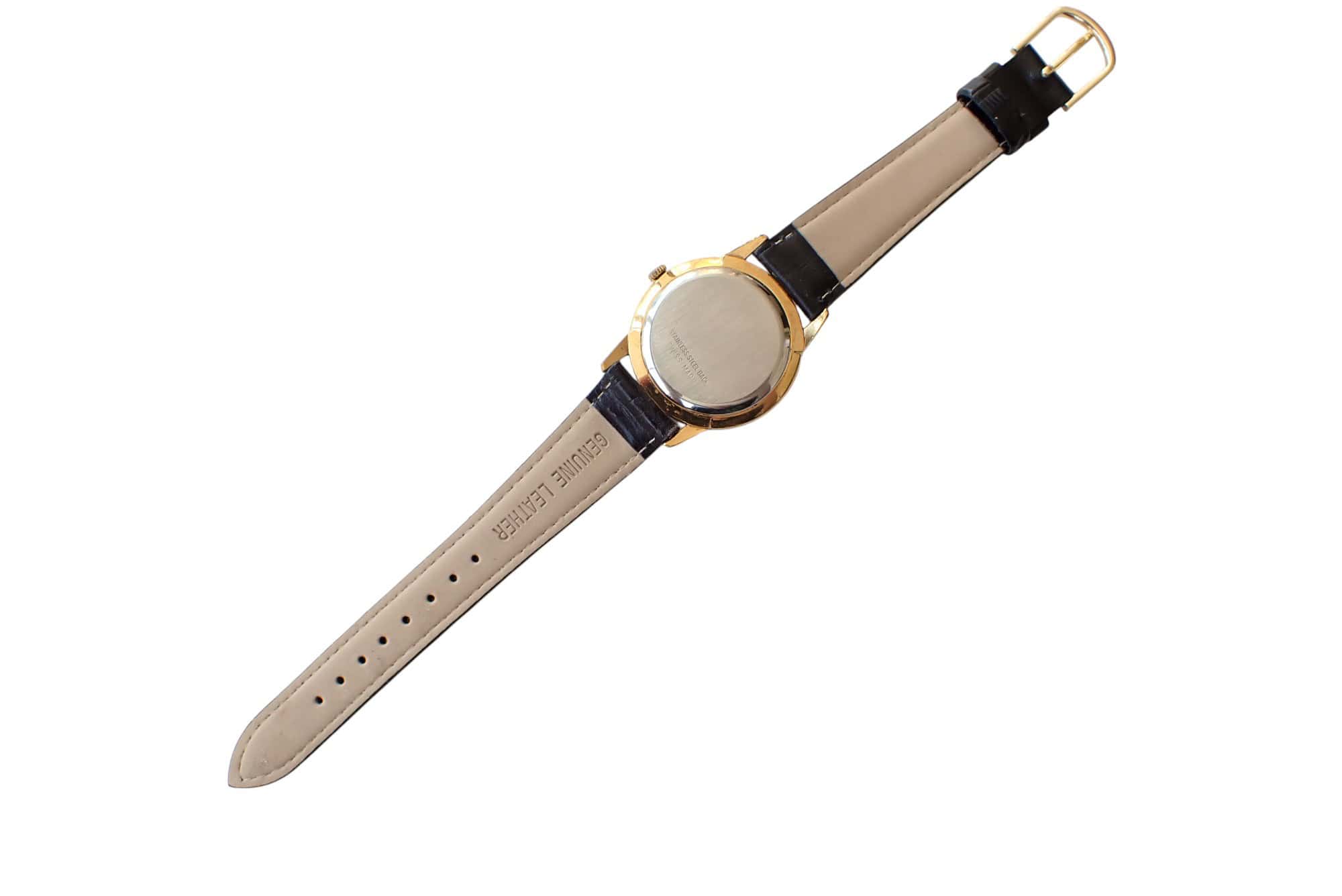 Luxurious gold and black wristwatch with leather strap, back view isolated on white.
