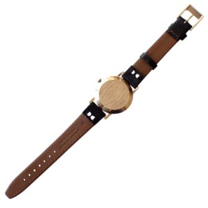 Vintage watch with leather strap and engraved back, classic accessory by The Watchaholic.