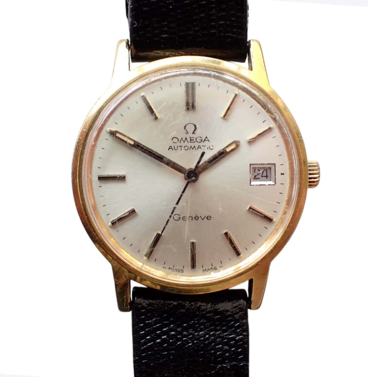 Vintage Omega Genève automatic wristwatch with gold case and black leather strap.