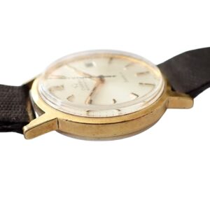 Vintage gold wristwatch with leather strap, classic men's luxury timepiece.