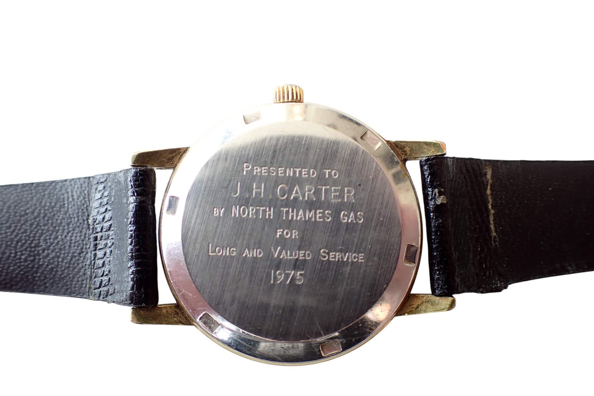 Vintage wristwatch with engraved case back commemorating service by North Thames Gas, 1975.