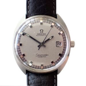 Vintage Omega Seamaster Cosmic watch with a silver dial and black leather strap.