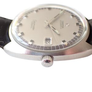 Omega Seamaster vintage wristwatch with silver dial and black leather strap.