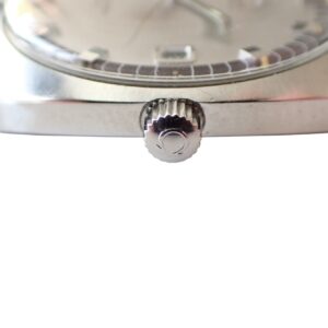 Stainless steel wristwatch crown and case close-up, luxury men's watch design.