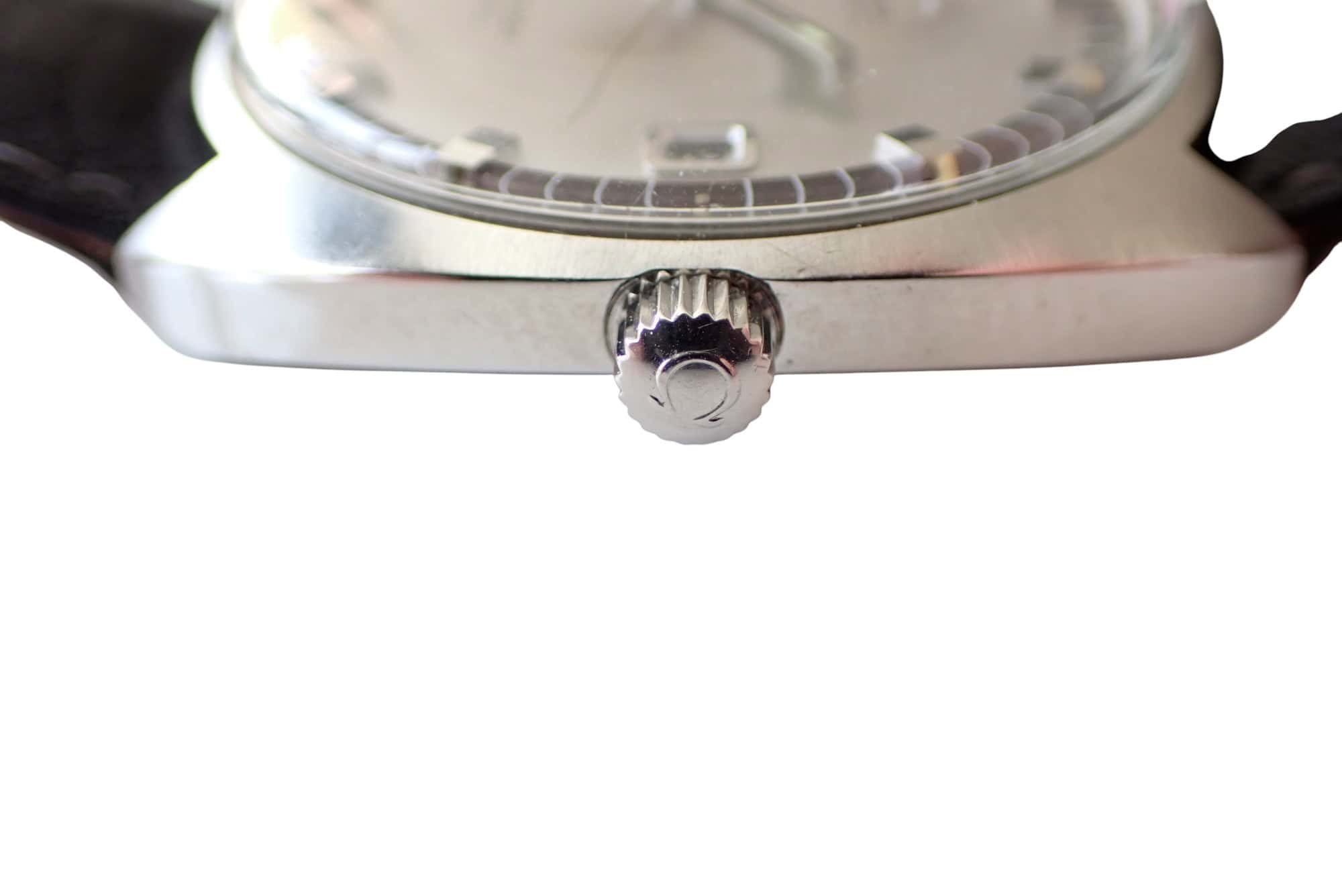 Stainless steel wristwatch crown and case close-up, luxury men's watch design.