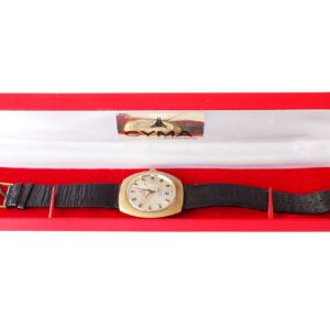 Silver vintage watch with black leather strap in red box.