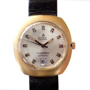 Vintage Cyma Conquistador automatic watch with gold-tone case and black leather strap, Swiss-made luxury timepiece.