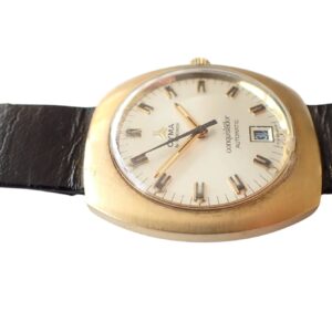 Stainless steel men's vintage watch with gold-tone case and black leather strap.