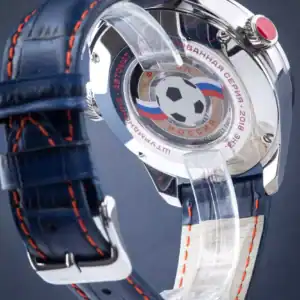 High-end wristwatch with football Soviet Union emblem and Russian flag, luxury watch craftsmanship.