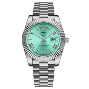 The Nibosi Classic Day Date Watch 2628 features a silver metal strap, aqua blue dial, Roman numeral hour markers, day display at 12 o’clock, date window at 3 o’clock, and the NIBOSI logo on the dial.
