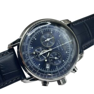 A close-up of the Zeppelin Airship Commemorative Version Men's Watch 2025 featuring a dark blue dial, silver casing, blue leather strap, three chronograph sub-dials, and a date window.
