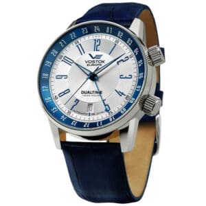 The Vostok Europe GAZ 14 LIMOUSINE Automatic NH35-5651138 features a silver dial, blue outer ring, dual time display in 12- and 24-hour formats, two right-side crowns, and a blue leather strap. Pay in three with Klarna.