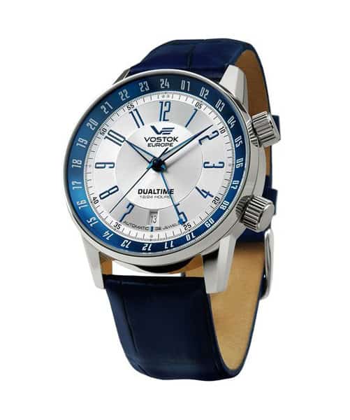 The Vostok Europe GAZ 14 LIMOUSINE Automatic NH35-5651138 features a silver dial, blue outer ring, dual time display in 12- and 24-hour formats, two right-side crowns, and a blue leather strap. Pay in three with Klarna.